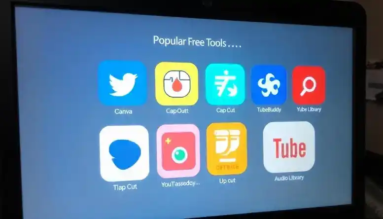 Free tools like Canva, TubeBuddy, and CapCut displayed on a computer screen for YouTube beginners. 