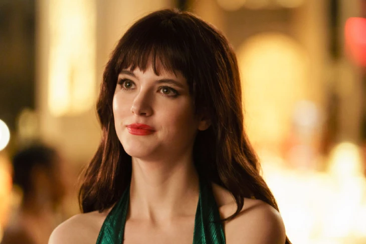 Ainsley Seiger net worth: Actress smiling on set of Law & Order: Organized Crime, symbolizing her rising career and growing wealth.