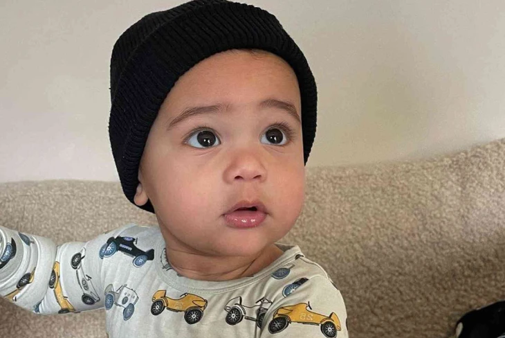 Aire Webster net worth: Kylie Jenner's son sits surrounded by luxury toys, symbolizing his estimated $500 million fortune.