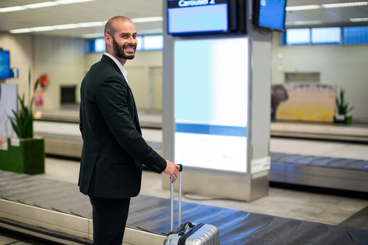 Advanced airport technology showing biometric scanners and digital displays at modern terminal